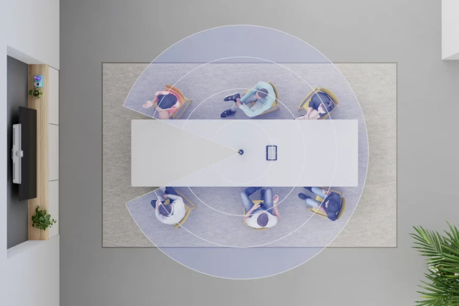 Top-down view of a hybrid meeting room with Logitech Sight capturing participants around a conference table using intelligent multi-participant framing.