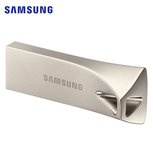 A sleek, metallic Samsung Bar Plus 128GB USB flash drive, angled to show its unique design with a triangular loop at one end.