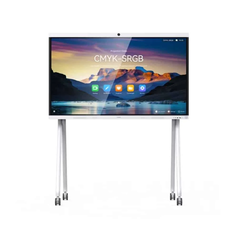 A front view of a large, white interactive display screen with a wide white bezel, mounted on a white mobile stand with four visible wheels. The screen displays a colorful landscape image with the text "CMYK-SRGB" centered on it. Below the text, there are several application icons, including a green "D" icon, a white brush icon, and a blue folder icon. A small camera is visible at the top center of the display's bezel.