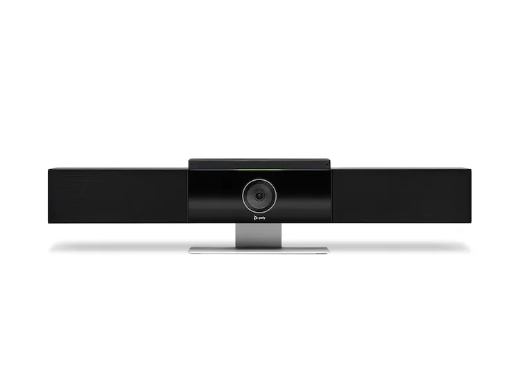 A full-frame, front-facing view of a black Poly Studio USB conference camera and soundbar, centered against a clean white background. The device features a central camera unit with a prominent silver-ringed lens and the "poly" logo below it. This central unit is flanked on either side by long, rectangular black speaker grilles with a textured finish. The entire unit is supported by a sleek, silver rectangular stand with a flat base. A thin, horizontal light strip above the camera unit glows green.