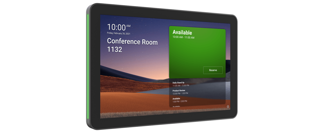 A Logitech Tap Scheduler device for a meeting room. The screen shows the time as 10:00 AM and identifies the room as "Conference Room 1132". A large green box indicates the room is "Available" from 10:00 AM to 11:00 AM with a "Reserve" button. The schedule for the rest of the day is listed below. The device has a green light on the left side, signaling availability.