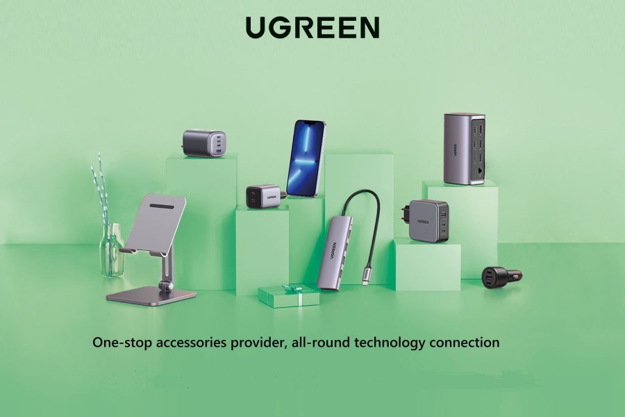 A collection of UGREEN electronic accessories, including multi-port wall chargers, a USB-C hub, a car charger, and a phone stand, displayed on green pedestals.