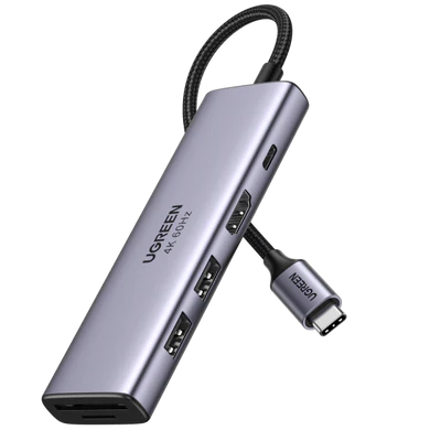 A UGREEN 6-in-1 USB-C Hub in metallic grey, featuring a braided cable and multiple ports including HDMI and SD card slots, with "UGREEN 4K 60Hz" printed on top.