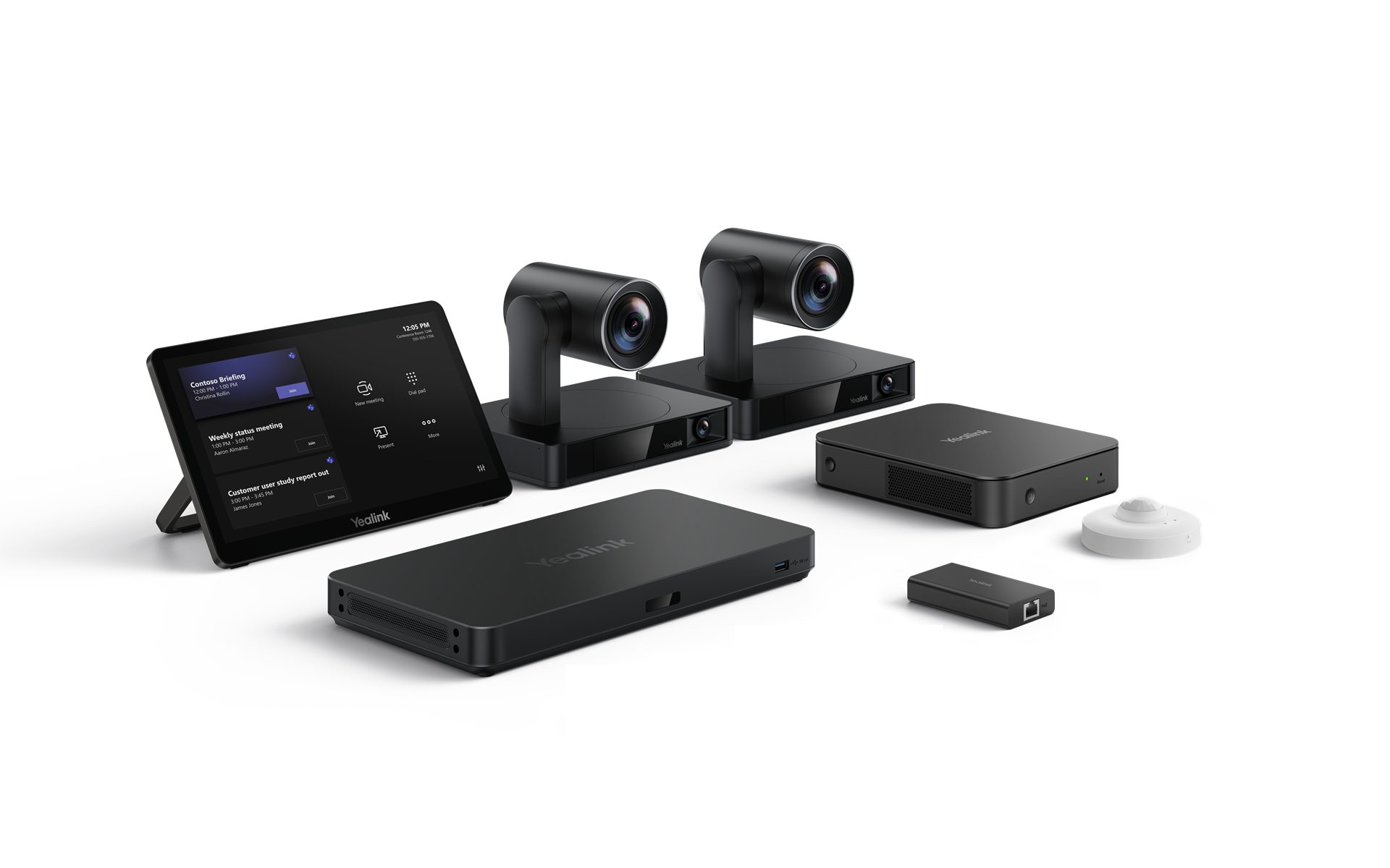 A professional setup of Yealink video conferencing equipment arranged on a white surface. From left to right, there's a black tablet displaying what appears to be a meeting schedule or interface. Behind it are two identical, sleek black cameras with cylindrical lenses mounted on rectangular bases. In front of the cameras are two rectangular black devices, one slightly larger than the other, both with the Yealink logo. To the far right, there's a small, rectangular black dongle and a small, white, circular device, likely a microphone or speaker.
