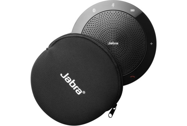 A Jabra Speak 510 UC speakerphone, a black, circular device with a perforated speaker grille and illuminated touch controls, positioned behind its matching black, zippered carrying case with the "Jabra" logo prominently displayed.
