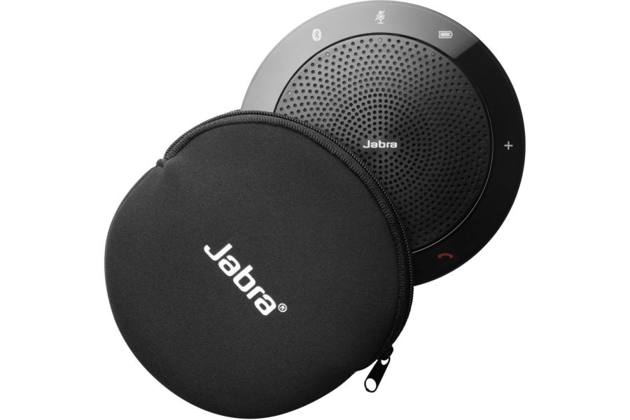 A Jabra Speak 510 UC speakerphone, a black, circular device with a perforated speaker grille and illuminated touch controls, positioned behind its matching black, zippered carrying case with the "Jabra" logo prominently displayed.